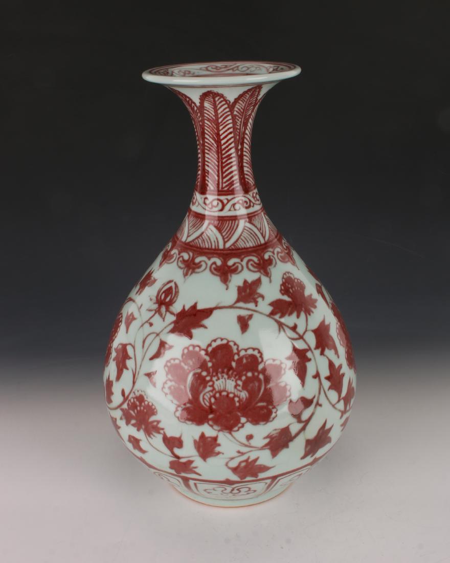 CELADON AND OXBLOOD VASE: CELADON AND OXBLOOD VASE : Has a wide flange rim with a tendril border around the lip. The neck has a plantain border, over a tendril border over, a wave border, over a ruyi border. The body is decora