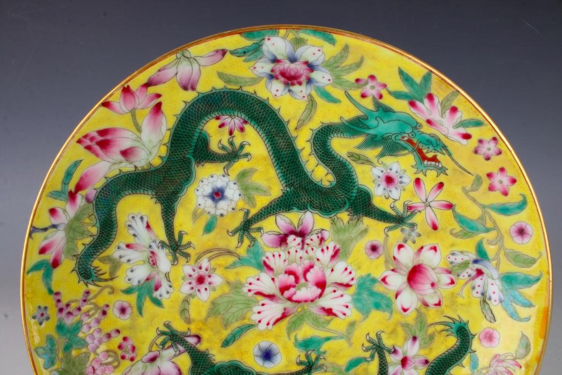 YELLOW PLATE WITH DRAGONS AND FLOWERS: YELLOW PLATE WITH DRAGONS AND FLOWERS : Green dragons fly a bright yellow ground with pink and blue flowers. The outer rim has five orange bats. Marked on the bottom. 8 1/2&q