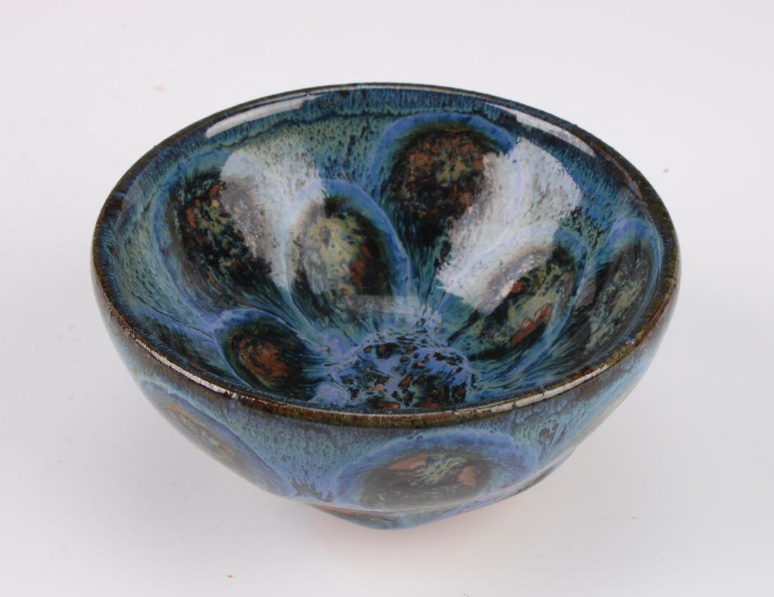 SMALL PEACOCK GLAZE BOWL: SMALL PEACOCK GLAZE BOWL: Small peacock glaze bowl with a thick drip glaze that stops at the unglazed bottom and foot. 3 1/2" X 1 3/4" $300 - $500