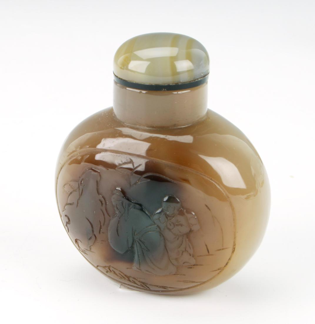 AGATE SNUFF BOTTLE: AGATE SNUFF BOTTLE: Incised scene on one side of travelers. 3" $100 - $200 Shipping: We are able to pack and ship this item to