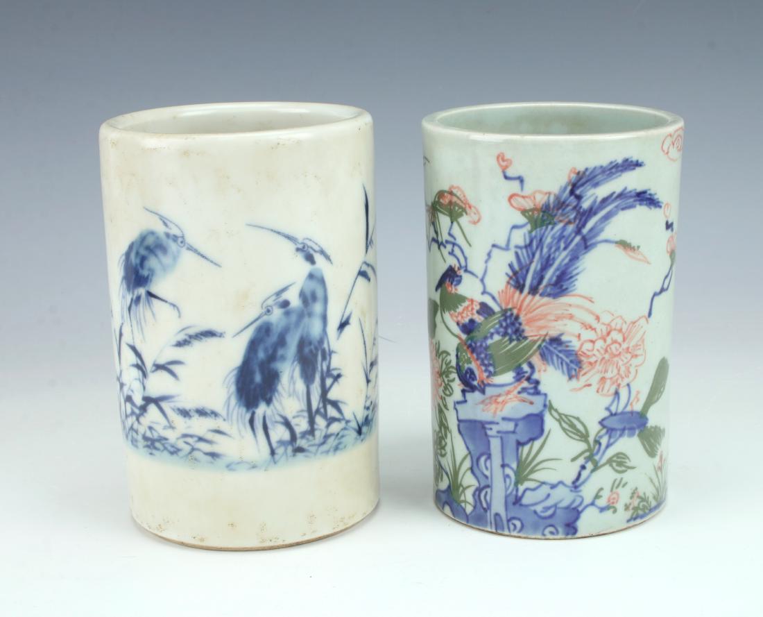2 SMALL CYLINDRICAL BRUSH POTS: 2 SMALL CYLINDRICAL BRUSH POTS: One is white with blue brushwork of water birds, calligraphy on the back. Marked on the bottom. The other is decorated in blue, red, and green with a garden scene inclu