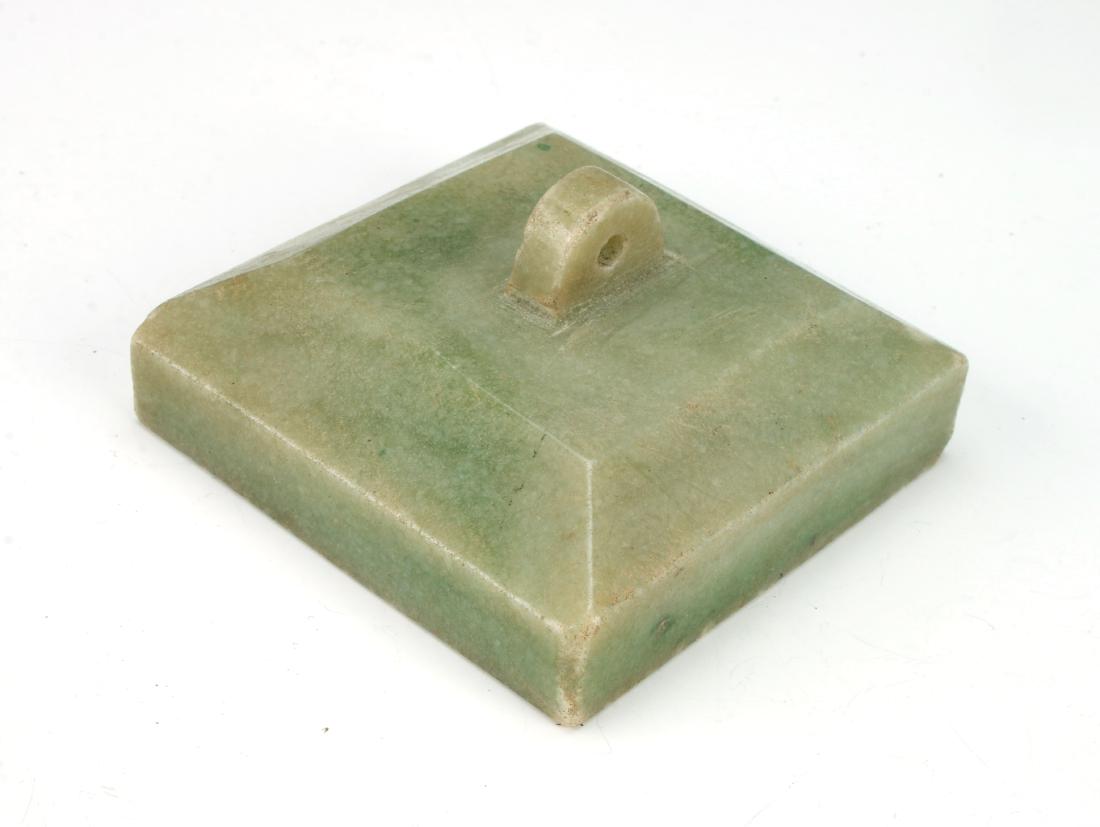 SQUARE STONE SEAL: SQUARE STONE SEAL: Short pyramid form, pierced at the top to hold a cord. Carved in characters on the bottom. 2 1/2" X 2 1/2" $40 - $80 Shipping