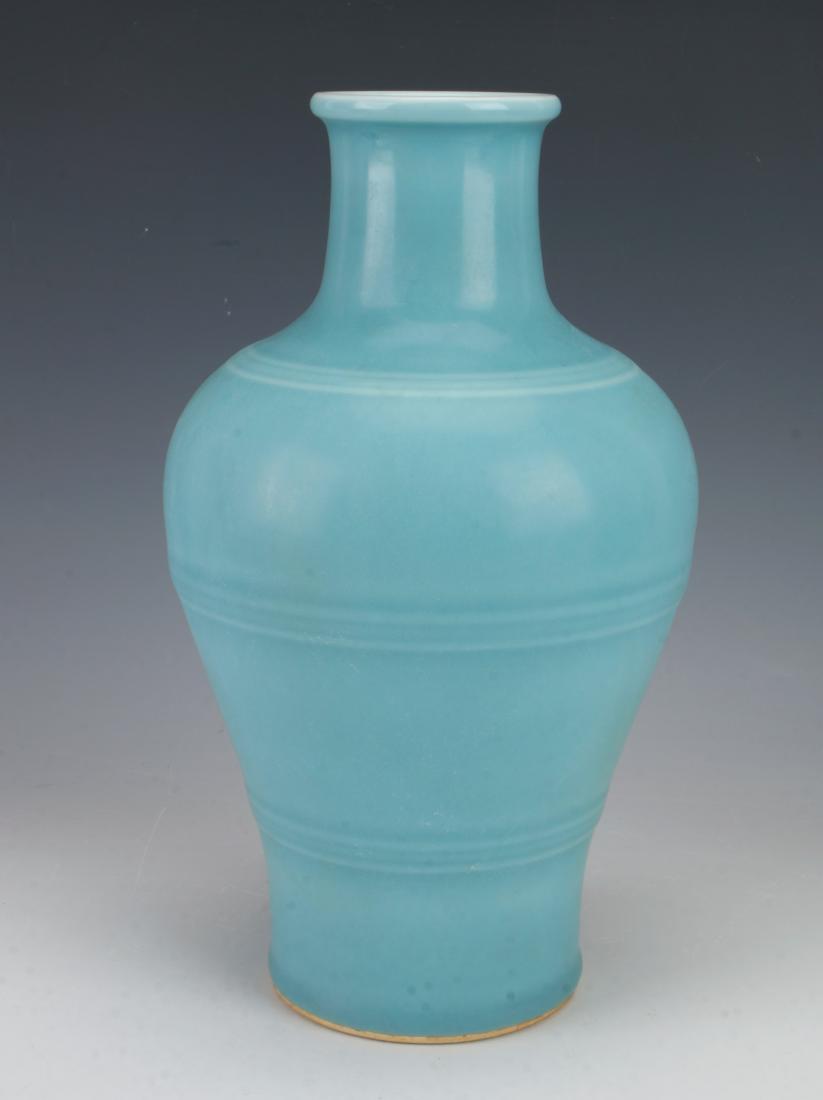 ROBINS EGG BLUE RIDGED VASE: ROBINS EGG BLUE RIDGED VASE : Has a ridged border at the shoulder, body, and waist. Glazed in robin's egg blue. Marked on the bottom. 6" X 10" $200 - $400