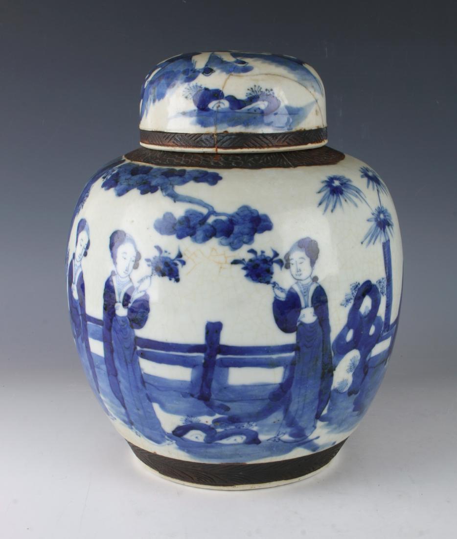 19TH BLUE & WHITE GINGER JAR: 19TH BLUE & WHITE GINGER JAR: Villagers are in a garden among flowers, trees, and boulders. The lid is decorated with a man holding a small bouquet. Marked on the bottom.