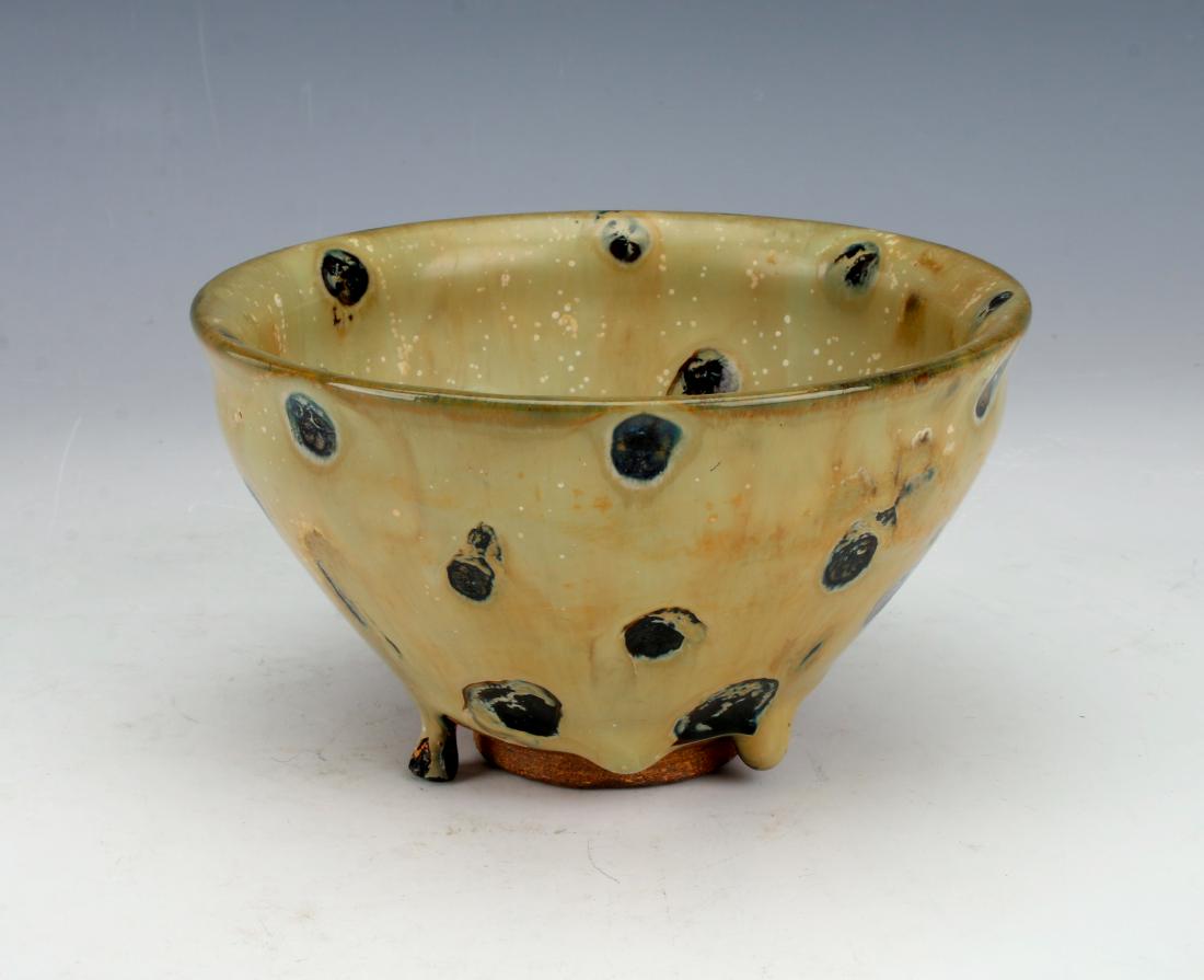 THICK DRIP GLAZE SPOTTED BOWL: THICK DRIP GLAZE SPOTTED BOWL: Light tan all over thick glaze with spots of shiny black. Variations in the black spots and the tan ground with artful drips and spatters. The heavy glaze drips on to th