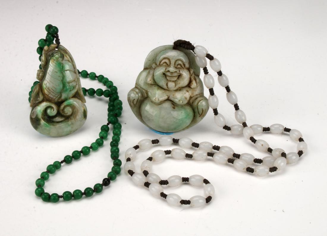 TWO JADE PENDANTS (1 of 4)