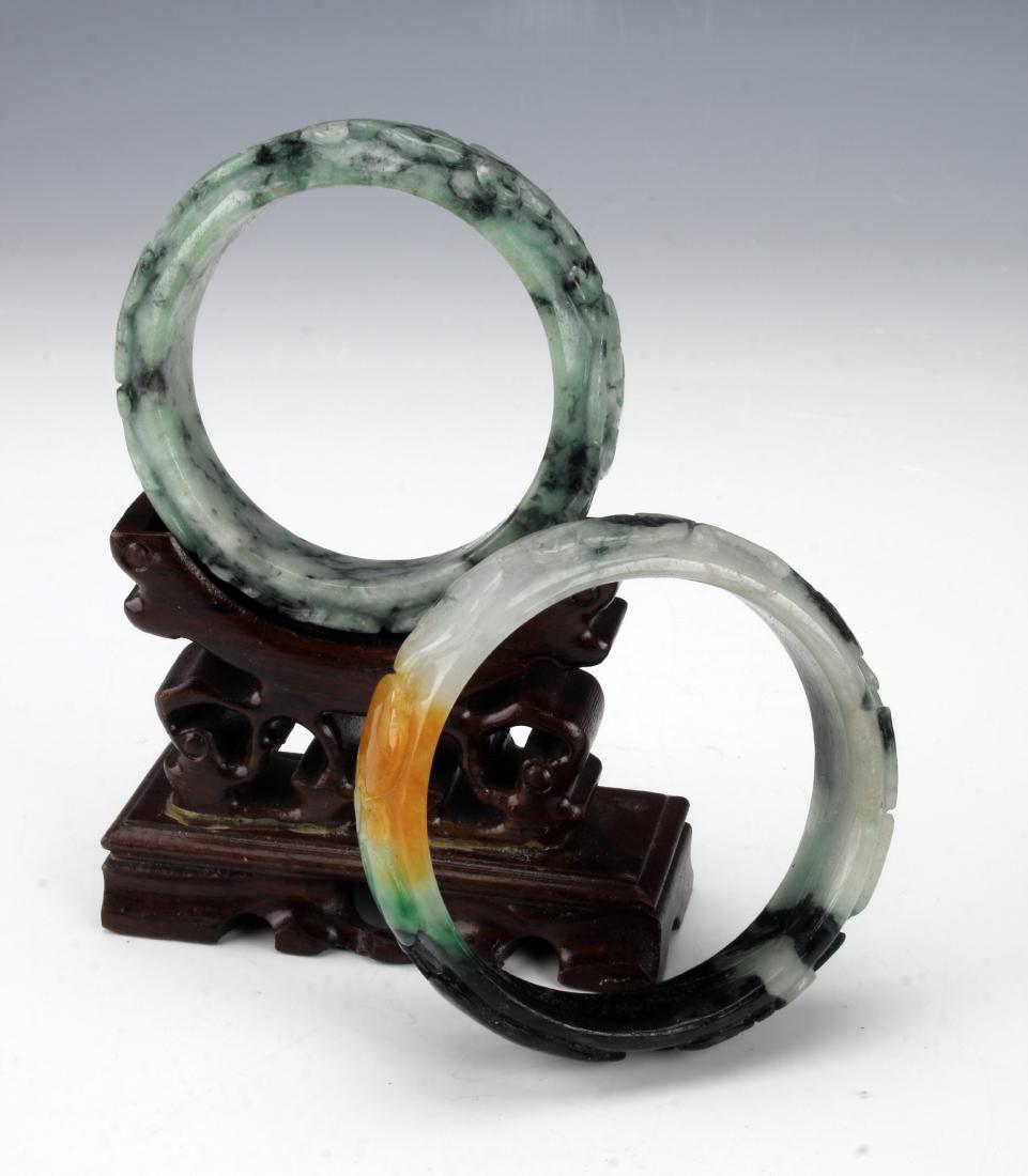 TWO CARVED JADE BANGLES (1 of 4)