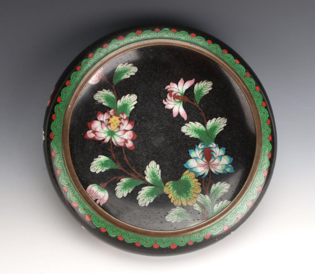 LOW BLACK FLORAL CLOISONNE BOWL: LOW BLACK FLORAL CLOISONNE BOWL: Black background with gold swirls, and bright pink and blue blossoms with green leaves. Turquoise enamel on bottom. 10 1/2" $