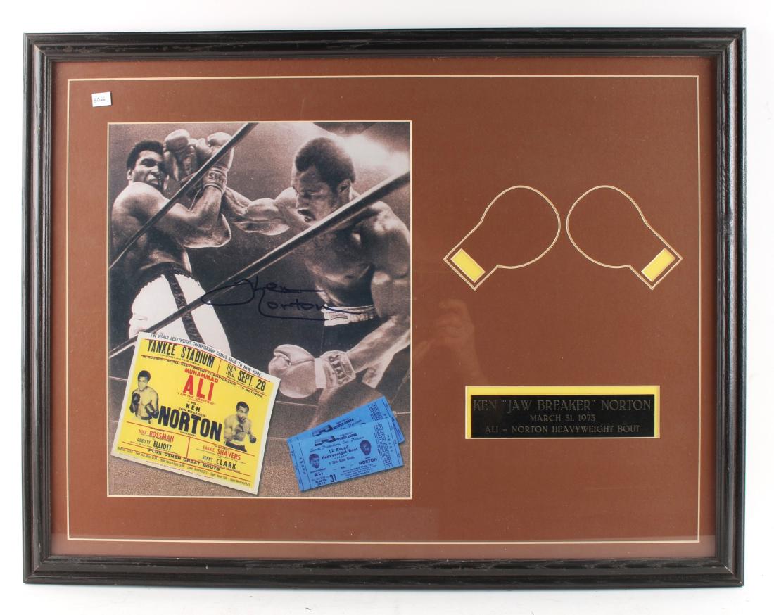 ALI - NORTON FRAMED PHOTO NORTON AUTOGRAPH: Click here to see this item in 3D. ALI - NORTON FRAMED PHOTO NORTON AUTOGRAPH: Photo of March 31 1973 Ali - Norton fight signed by Ken Norton.