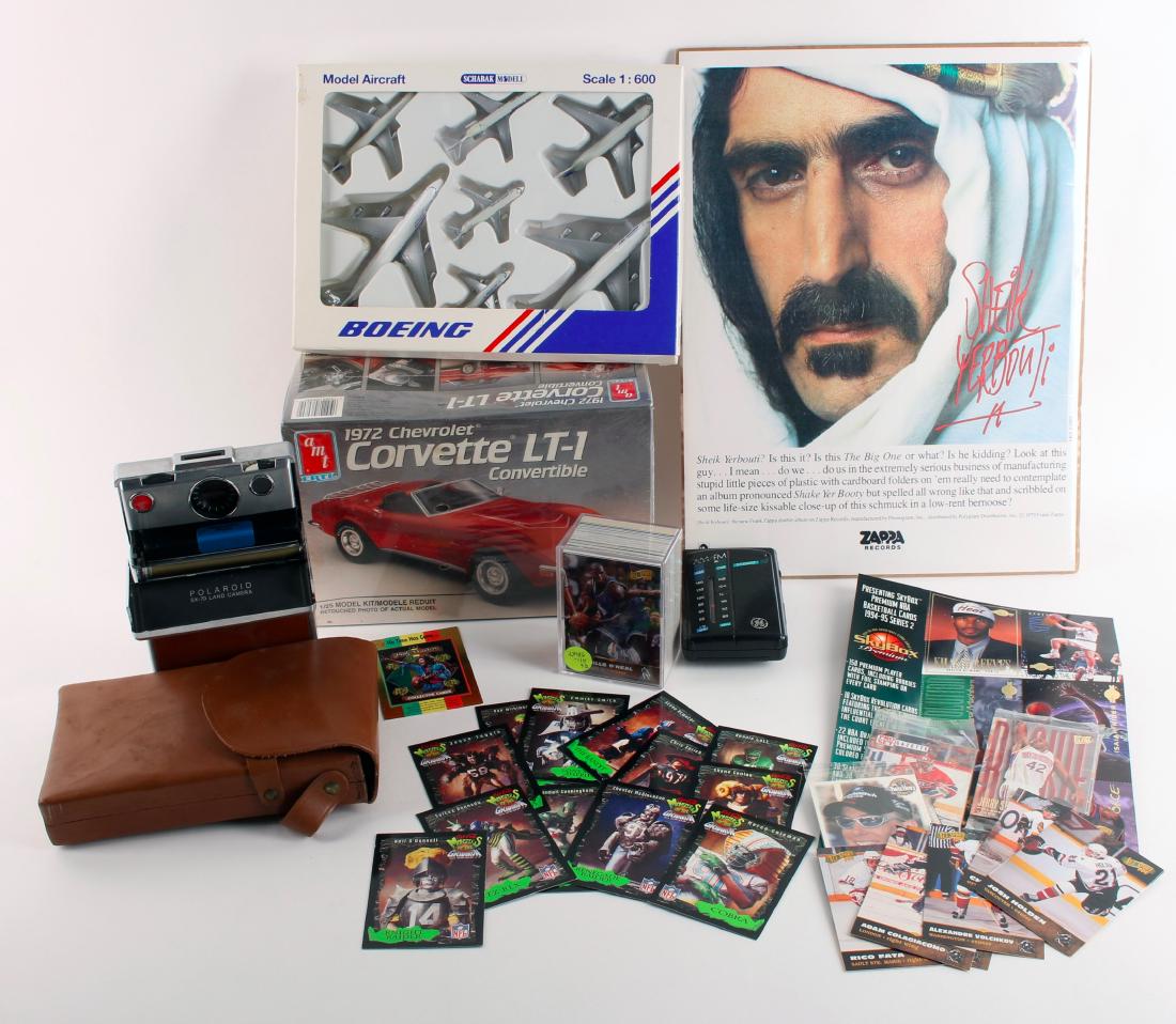 LOT INCL POLAROID SX-70 CORVETTE KIT FRANK ZAPPA: LOT INCL POLAROID SX-70 CORVETTE KIT FRANK ZAPPA: Including Polaroid SX-70 camera with case, sports trading cards, 1972 Corvette LT-1 kit in box, Boeing model aircraft in box, Frank Zappa poster, and
