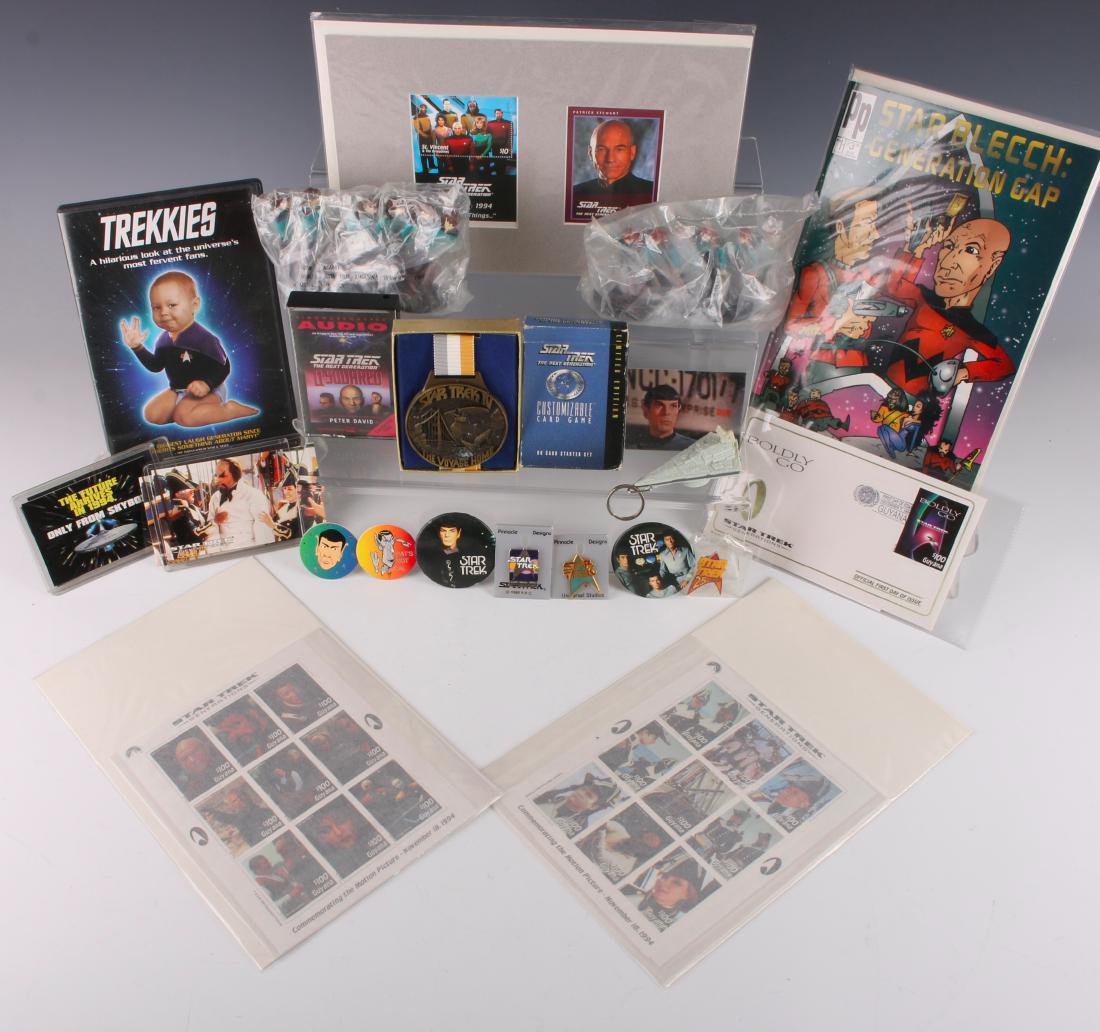 LARGE LOT STAR TREK NEXT GENERATION MEMORABILIA: LARGE LOT STAR TREK NEXT GENERATION MEMORABILIA: Including photos, pins, a spoof DVD, a stamp, a Star Trek 4 The Voyage Home medal, card game, audio cassette, and a comic book. New in packaging Deana 