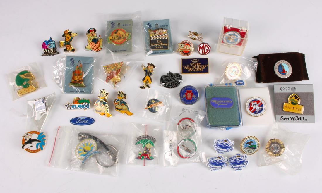 LOT 37 ASSORTED ENAMEL PINS SMEAT: LOT 37 ASSORTED ENAMEL PINS SMEAT: Large lot of enamel pins with travel, Skylab, Disney, and Jimmy Buffet themes. $40 - $80 Shipping: We are able to pack and