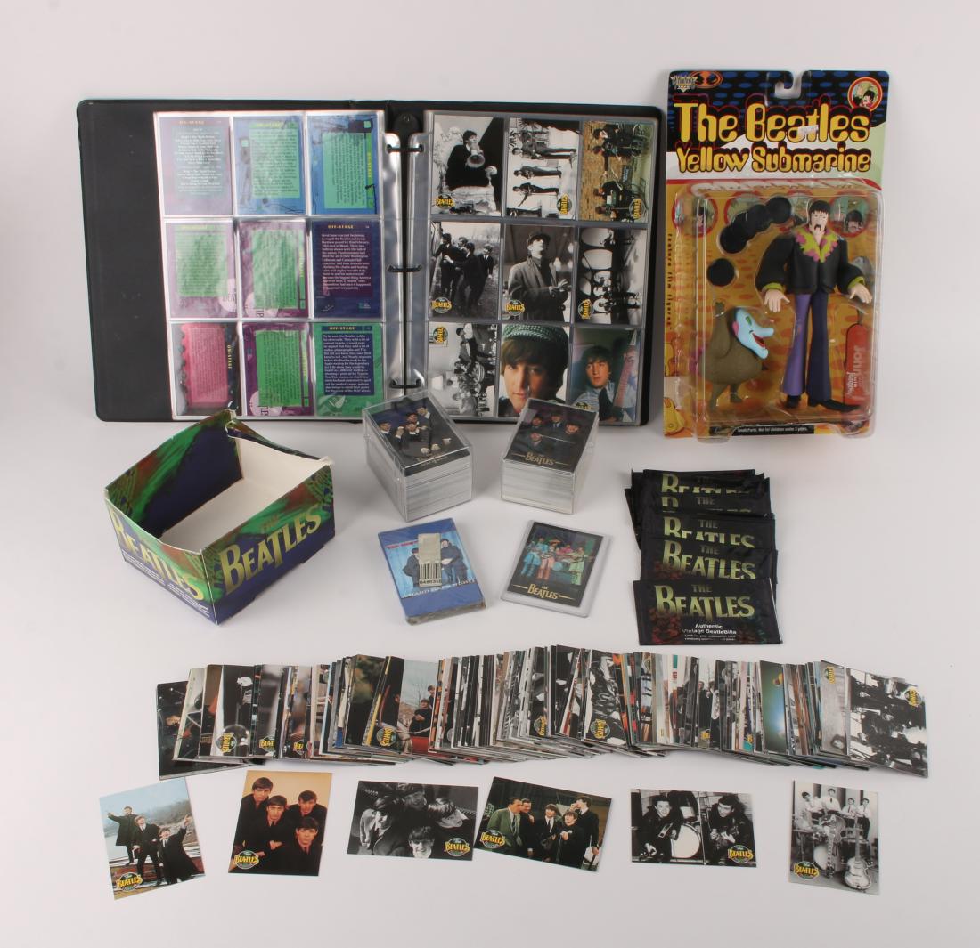 LOT OF BEATLES TRADING CARDS: LOT OF BEATLES TRADING CARDS: Included is a binder full of Beatles trading cards dated 1993, loose trading cards, a Yellow Submarine 1999 John with Jeremy figure in box, and a Hard Day's Night cassett