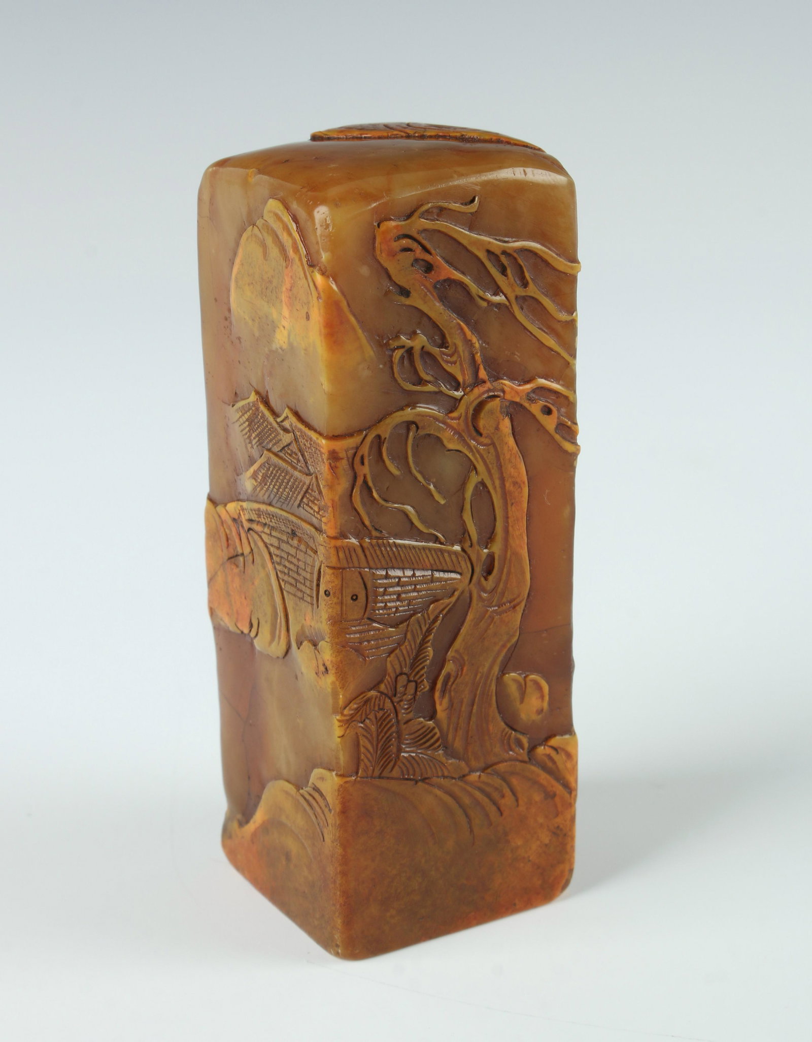 LARGE SHOUSHAN STONE LANDSCAPE SEAL: LARGE SHOUSHAN STONE LANDSCAPE SEAL: Decorated in a landscape with travelers in a forest with mountains in the distance. 3 1/4" X 1 1/4" $400 - $600