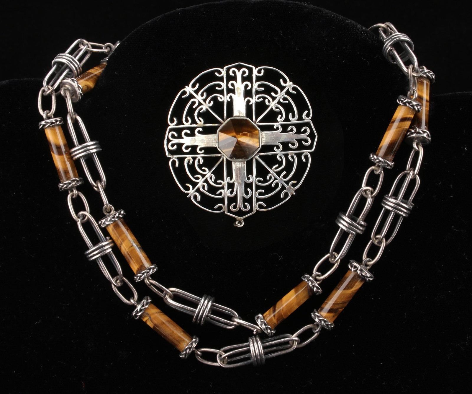CECILIA TONO TAXCO TIGER EYE STERLING JEWELRY: CECILIA TONO TAXCO TIGER EYE STERLING JEWELRY: The unusual brutalist tiger eye cylinder and sterling wire necklace signed Cecilia Tono on clasp, Taxco 925, #142 also. Tiger eye cylinders are capped by