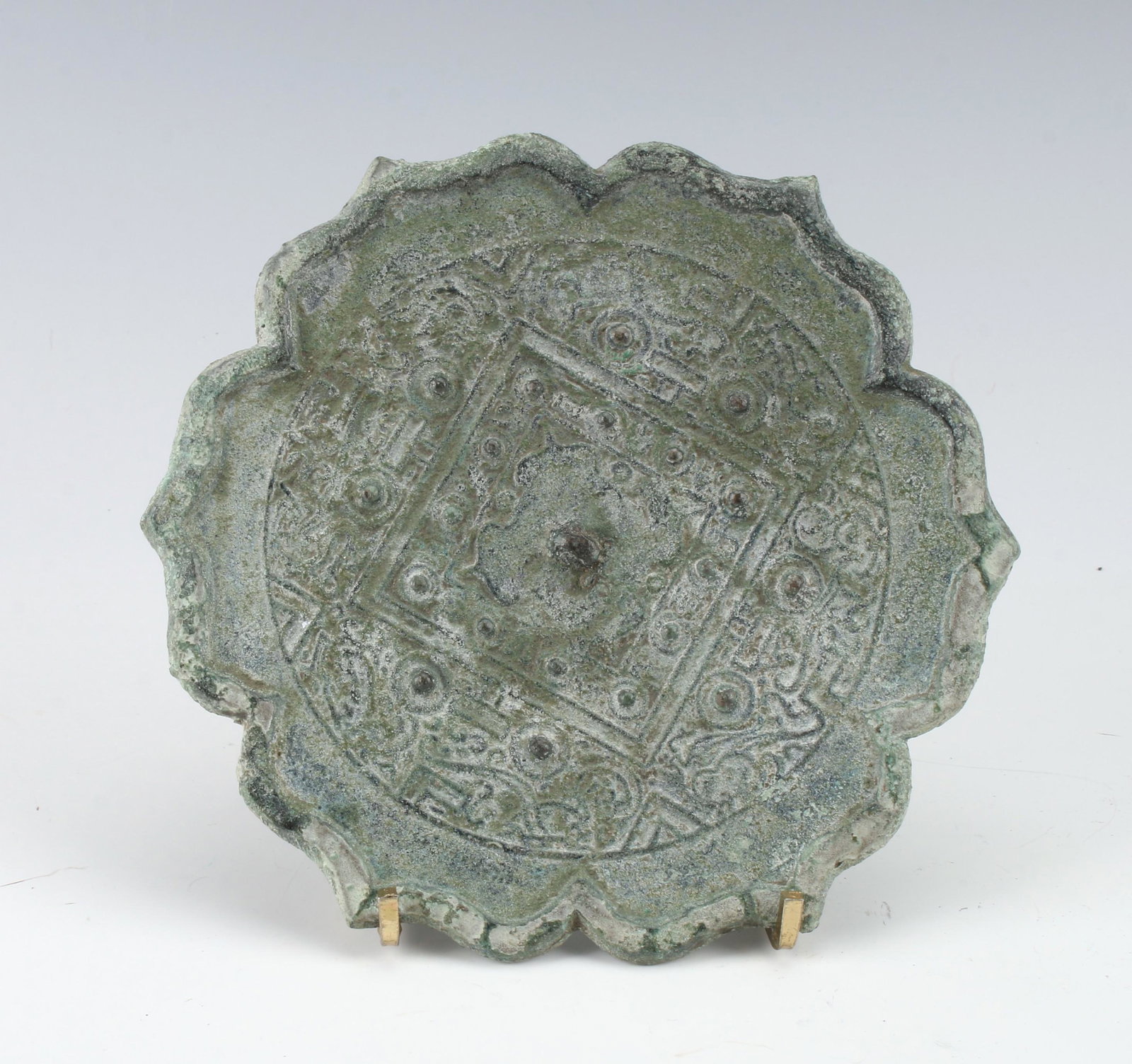 ARCHAIC BRONZE MIRROR: ARCHAIC BRONZE MIRROR: Raised lotus edge and verdigris patina in archaic patterns. 5 3/4" $40 - $80 Shipping: We are able to p
