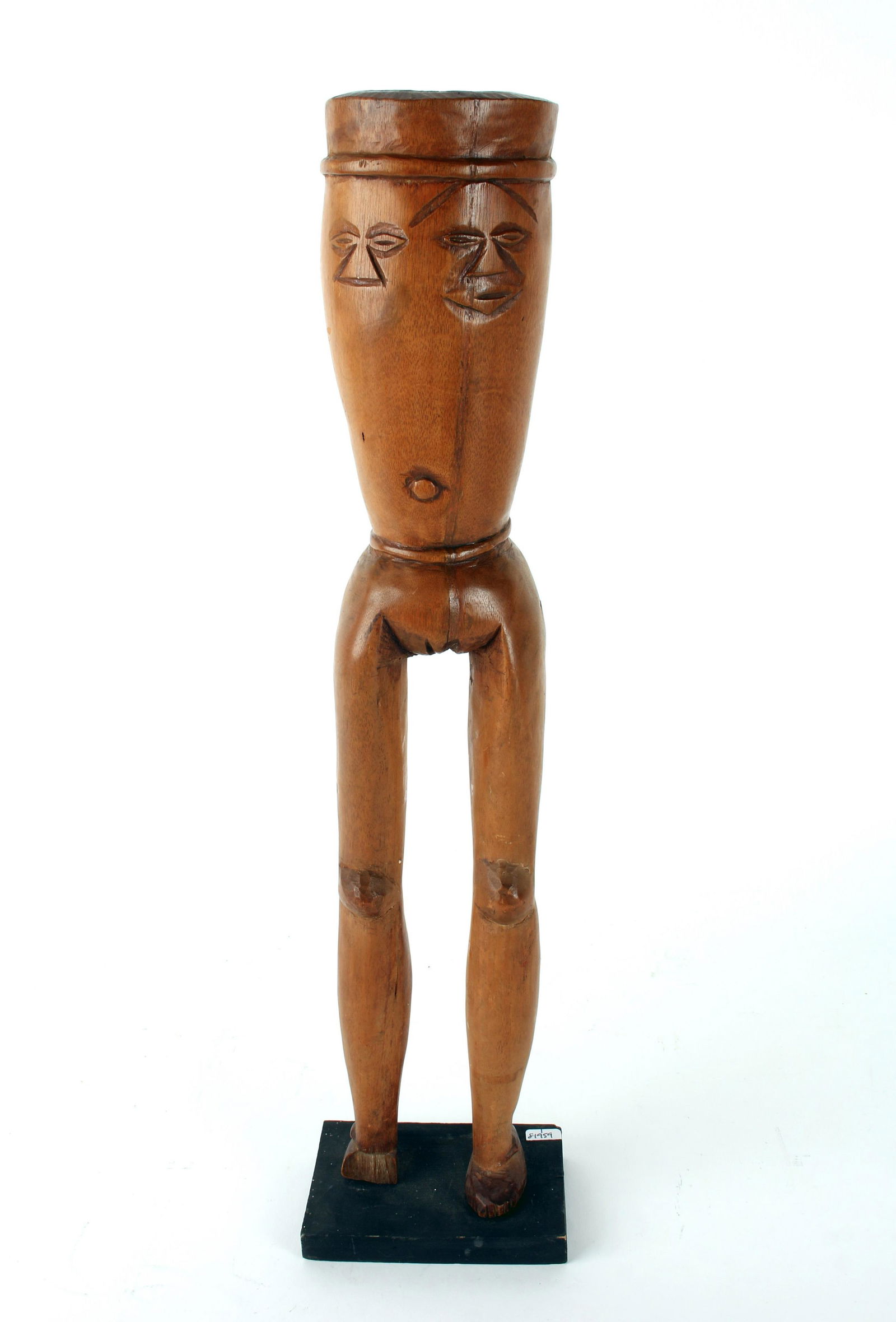 WOODEN CEREMONIAL FEMALE FORM CUP ON STAND: WOODEN CEREMONIAL FEMALE FORM CUP ON STAND: Carved in the form of a body of a woman, her waist forms the bottom of the cup. Incised faces surround the rim. 3" X 19"