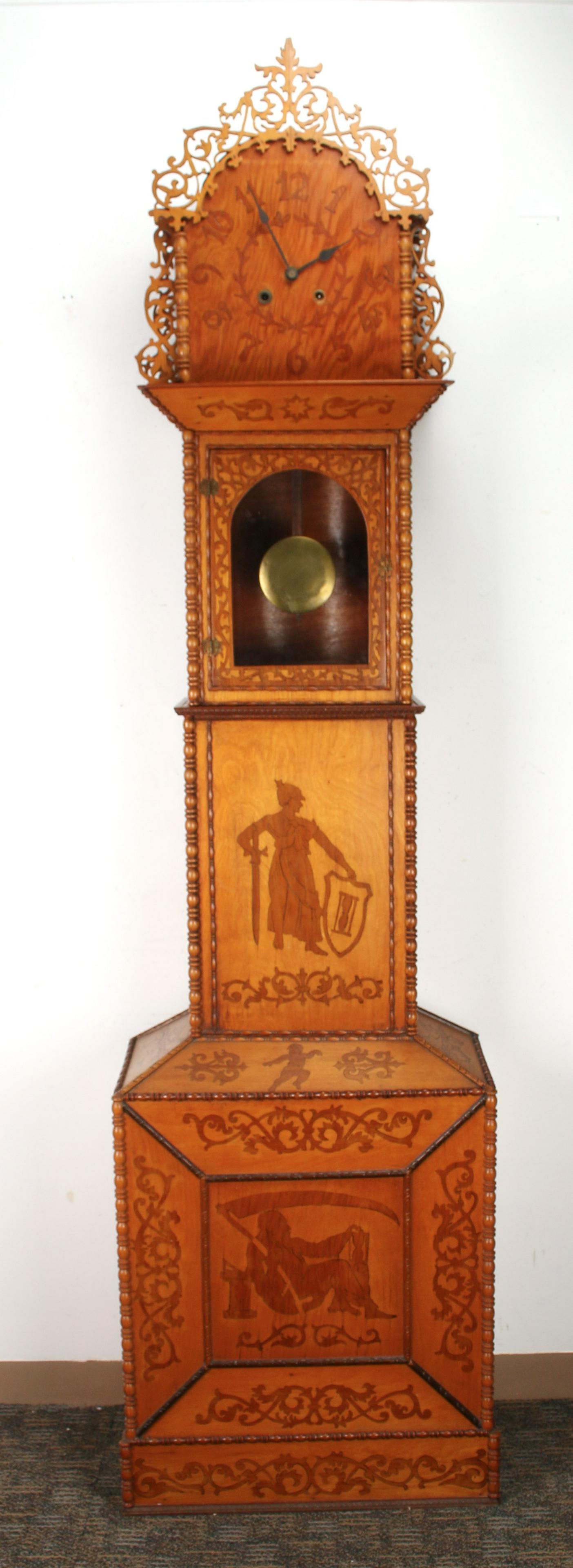 TRAMP ART FRETWORK TALL CASE CLOCK: TRAMP ART FRETWORK TALL CASE CLOCK: Tall case clock with sessions spring-driven movement. Extremely unusual, elaborate clock with inlaid, turned, and pierced decoration. Including mythological figures