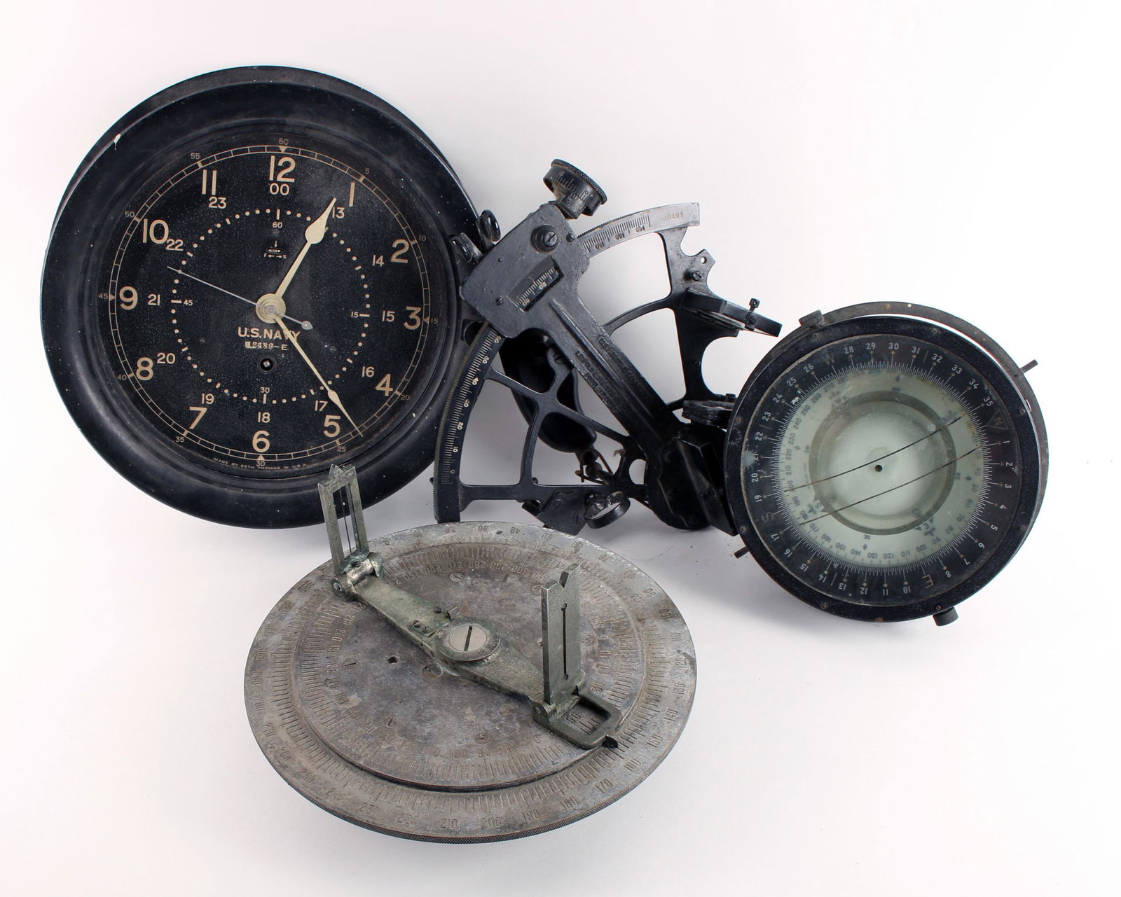 4 VINTAGE MILITARY INSTRUMENTS NAVY AIRFORCE: 4 VINTAGE MILITARY INSTRUMENTS NAVY AIRFORCE: Including a Gimbaled compass labeled AFUS Type D-12 Produced by Bendix Aviation Corporation, Seth Thomas clock marked US Navy 12489-E, sextant marked Leup