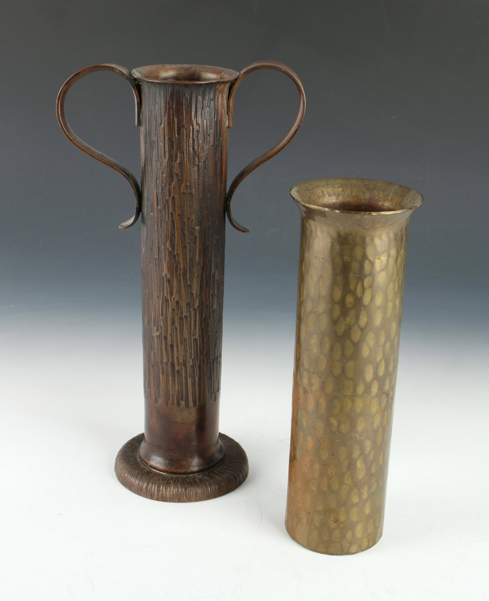 2 TRENCH ART VASES: 2 TRENCH ART VASES: With textured sides, base and applied S form handles. The other has a flared rim and textured sides. 9" $200 - $400 Shipping: