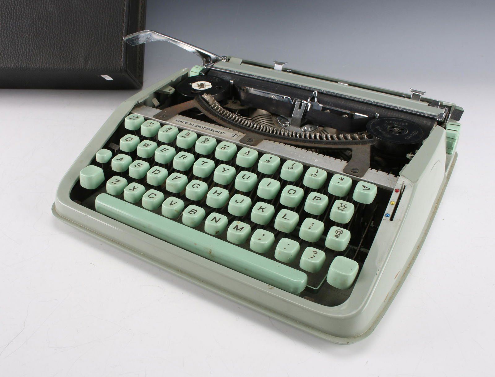 VINTAGE SWISS HERMES BABY PORTABLE TYPEWRITER: VINTAGE SWISS HERMES BABY PORTABLE TYPEWRITER : 13" X 12 1/2" $100 - $200 Shipping: We are able to pack and ship this item to an address in the Unit