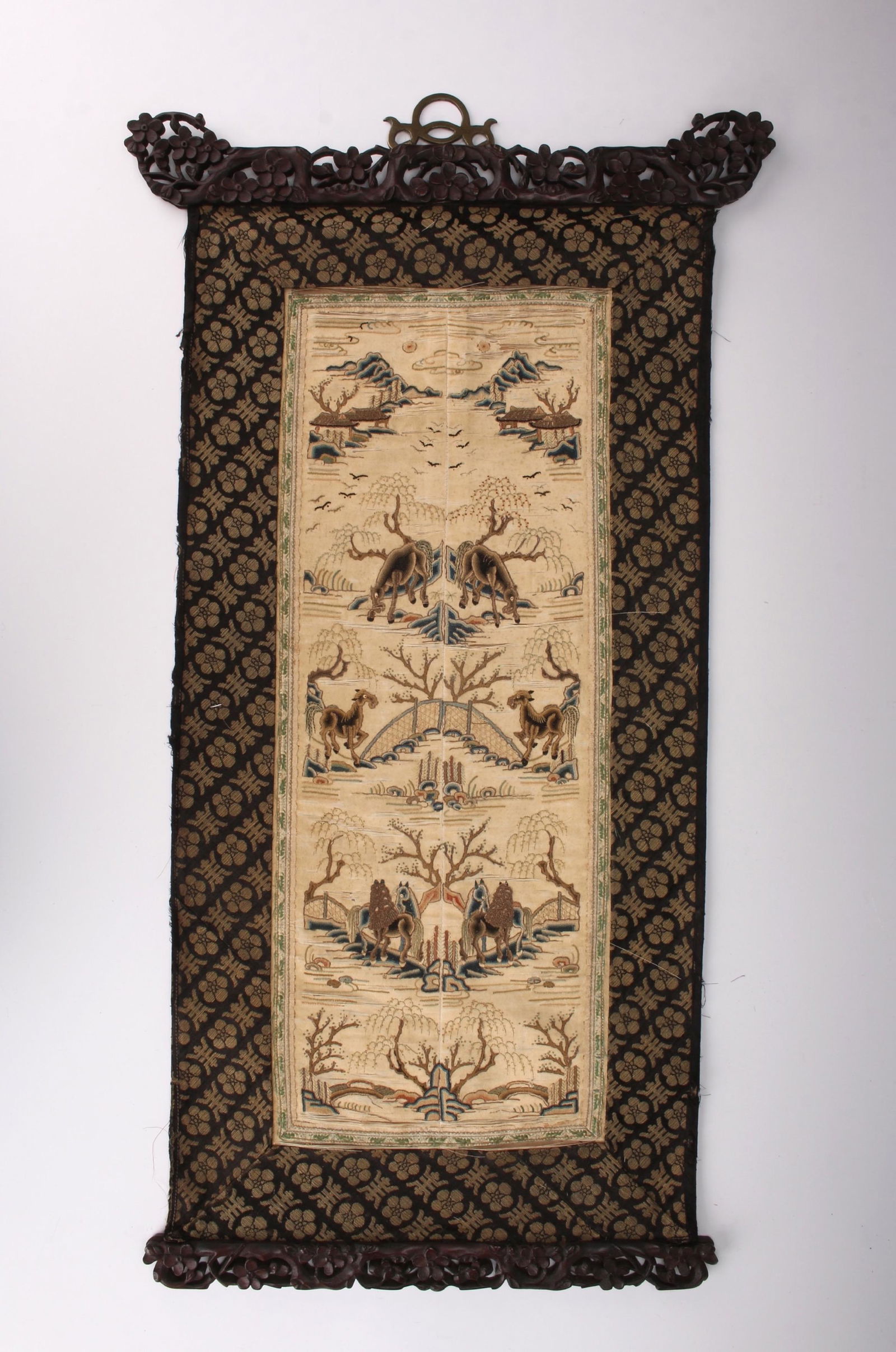 FINE 19TH C CHINESE EMBROIDERED WALL HANGING: FINE 19TH C CHINESE EMBROIDERED WALL HANGING: A silk embroidered wall hanging of horses with carved wooden top and bottom frame with bronze hanger. Top landscape scene with four scenes below. Below ar