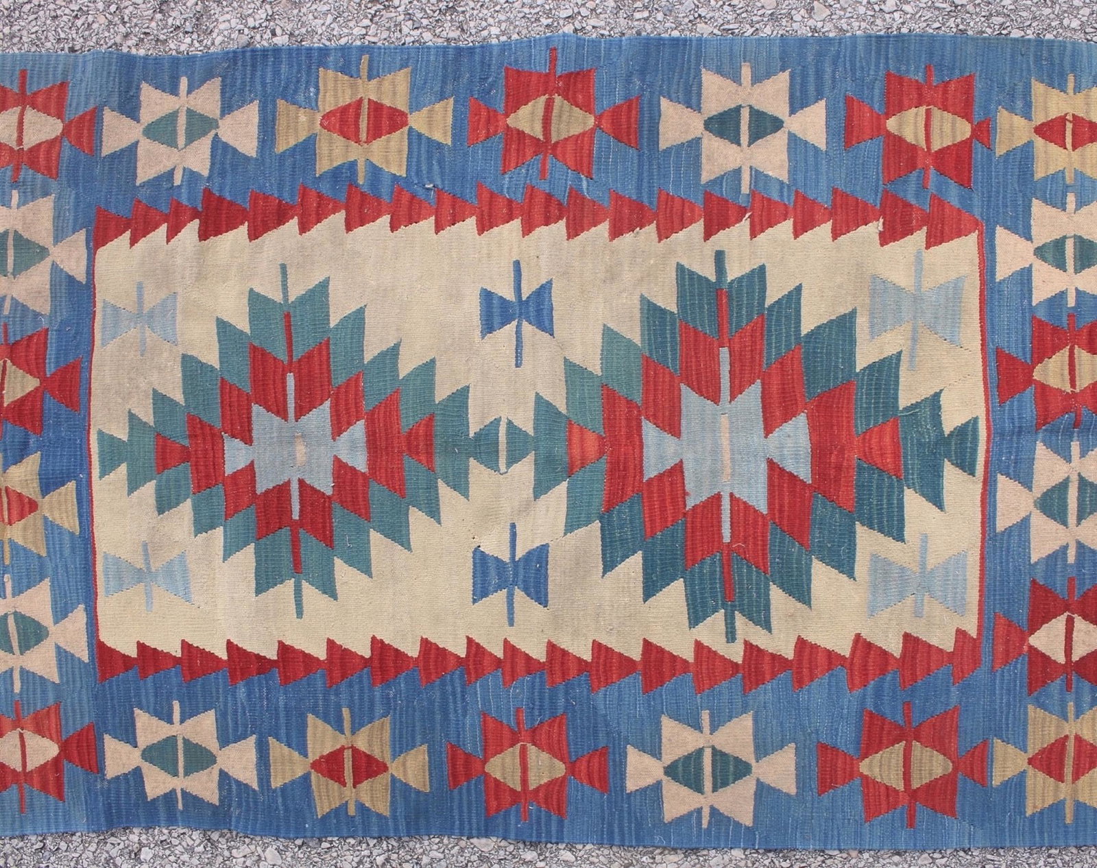 KILIM FLAT WEAVE THROW RUG: KILIM FLAT WEAVE THROW RUG: Geometric patterns with wide blue borders surrounding a central area with geometric medallions. 44" X 73" $200 - $400 T