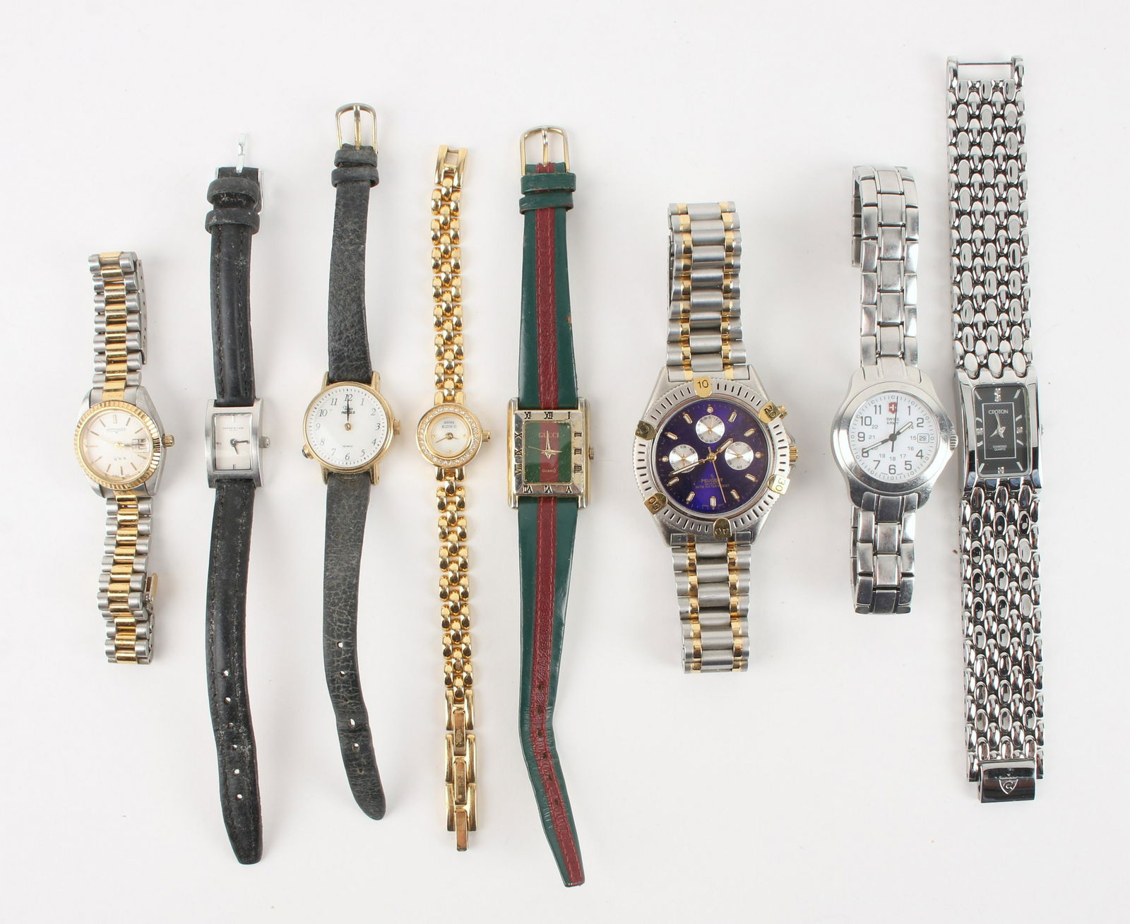LOT OF BRAND NAME FASHION WATCHES: Brands include Swiss Army, Kenneth Cole, Timex, Anne Klein, and Gucci. $40 - $80 Please contact us for high resolution images of this lot. Shipping: We are able to pack and ship this item t