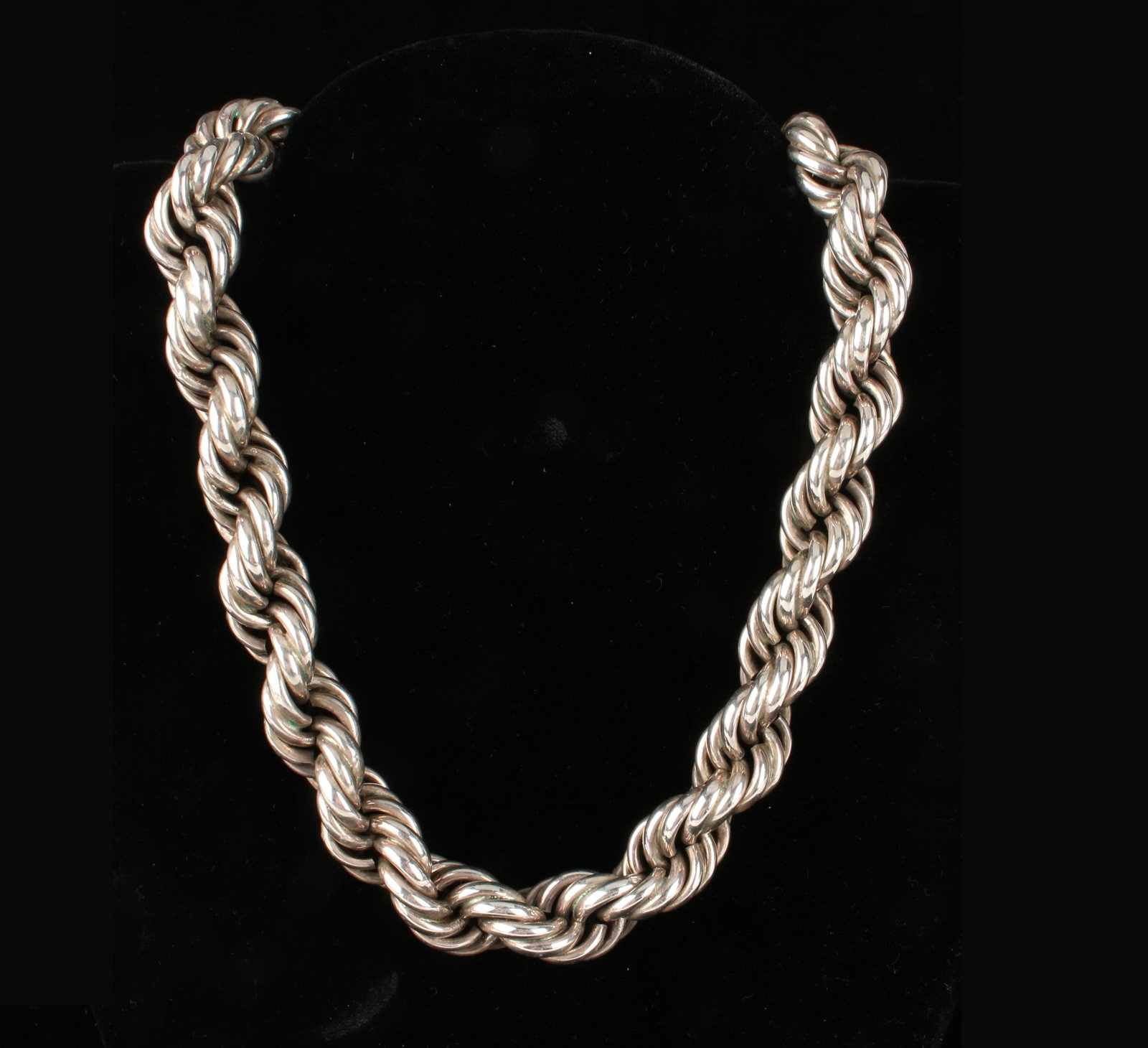 RARE VINTAGE MEXICAN STERLING ROPE CHAIN 158.7G: With snake head clasp securing heavy twisted rope chain. Finest silver work in this rare heavy neck chain. Chain 15.8mm wide 20" long. 158.7g 20" $500 - $800 Please cont