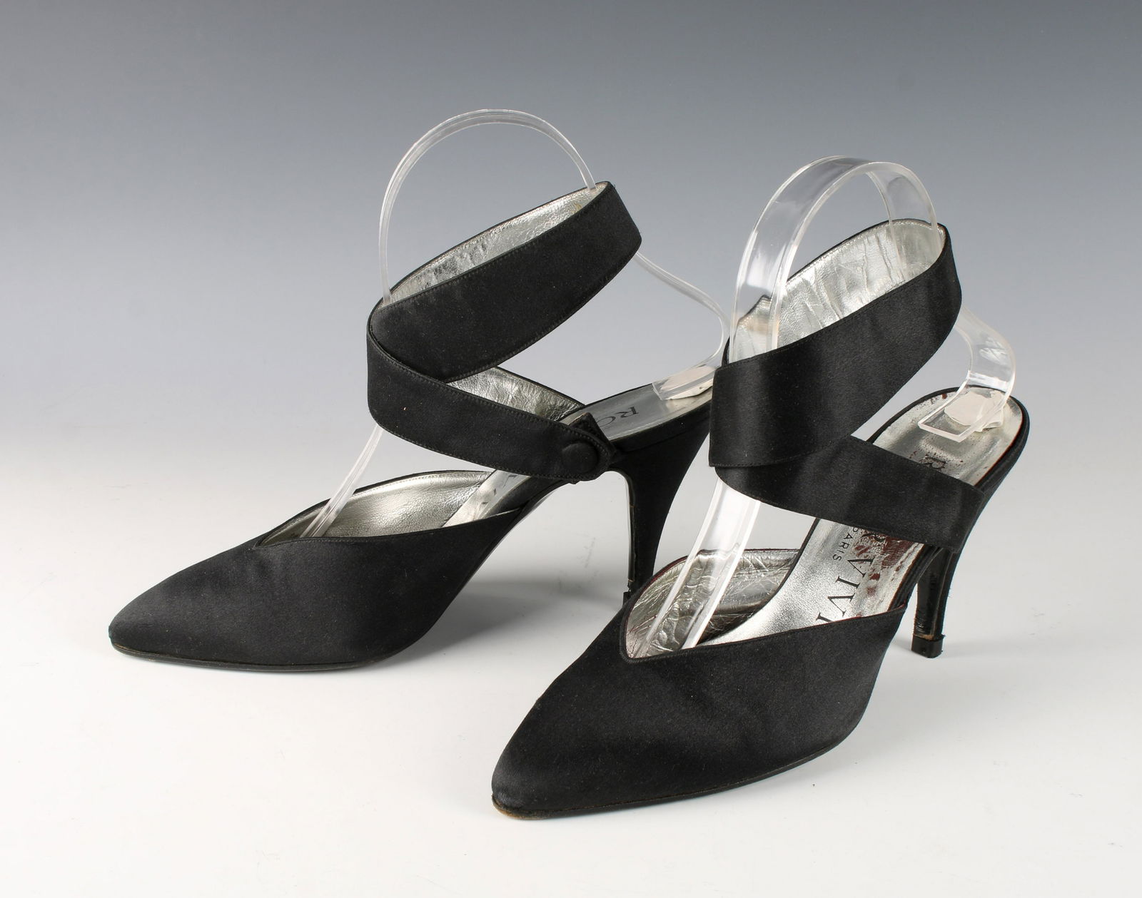 VINTAGE ROGER VIVIER PARIS SHOES: Black satin ankle wrap with a snap at the inside of the ankle with high heels. Size 8 1/2 $300 - $500 Please contact us for high resolution images of this lot. Shipping: