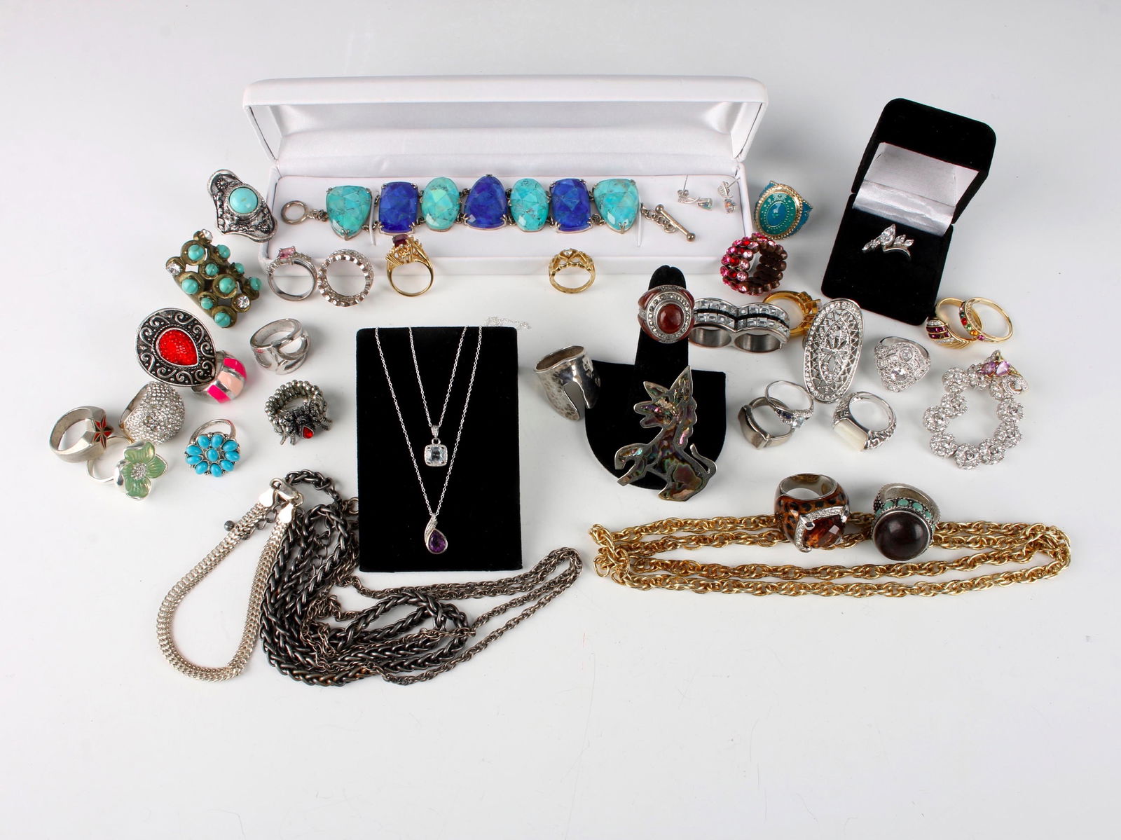 ASSEM. LOT STERLING, GF FASHION JEWELRY: Many sterling items and vintage costume jewelry. Rings, necklaces, chains, bracelets, and more! $40 - $80 Please contact us for high resolution images of this lot. Shipping: We are able to p