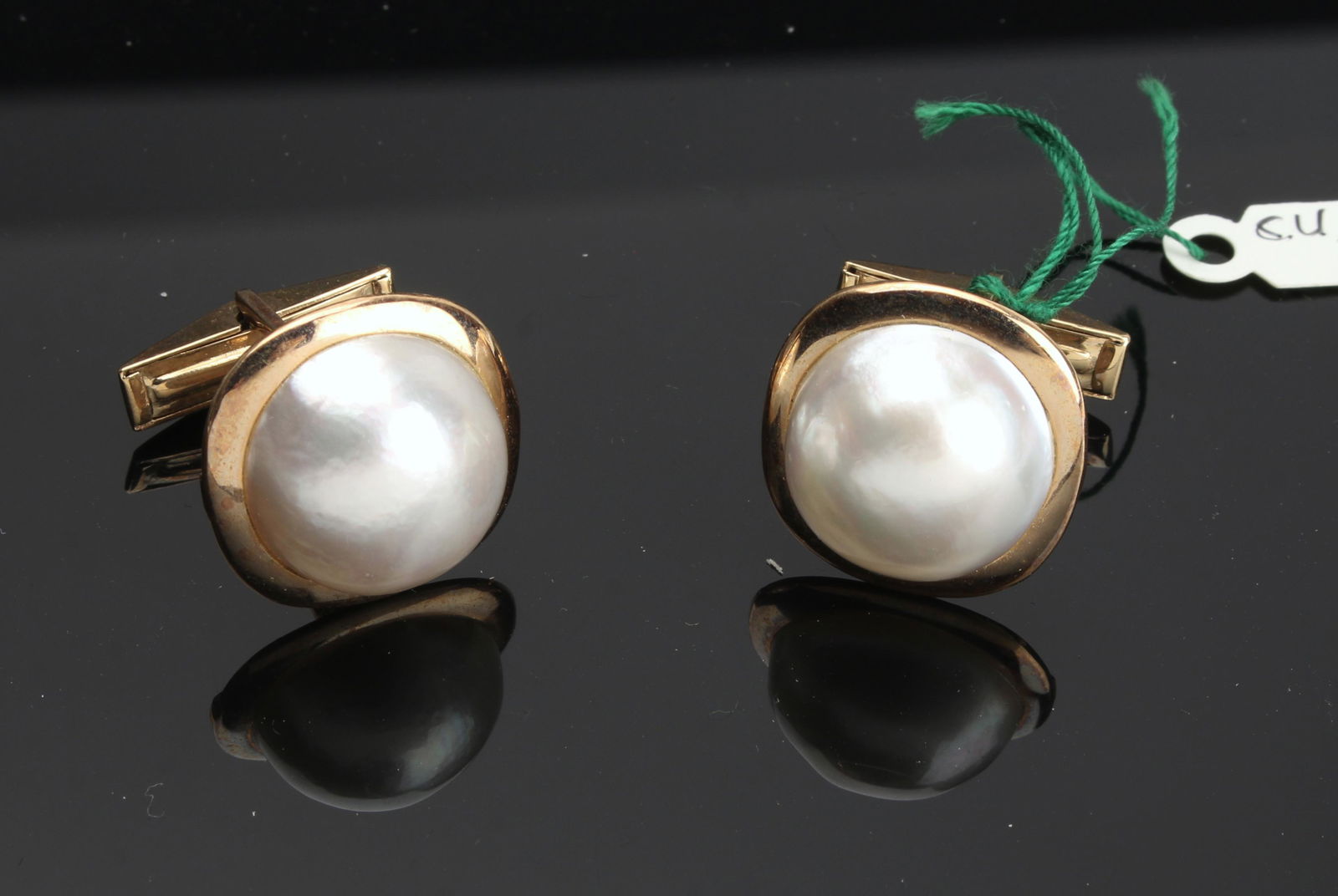 LUSTROUS MABE PEARL CUFFLINKS: Round white Mabé pearls are set on cushion shaped 14K yellow gold frames. With wing backs. New fine jewelry from 2nd generation Texas store retirement sal