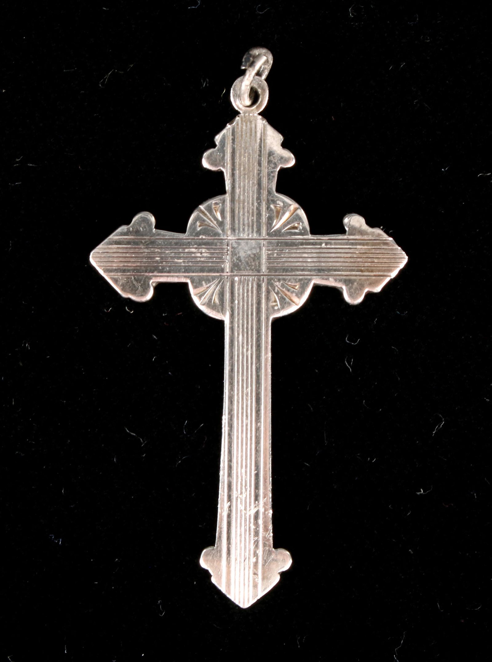 ANTIQUE ENGRAVED STERLING ART DECO CROSS PENDANT: Engraved with Art Deco lines. This pendant is marked sterling on the back. Consigned by Philadelphia collector of 1940s Mexican and Native American sterling jewelry. 2" $100 - $200 Ple