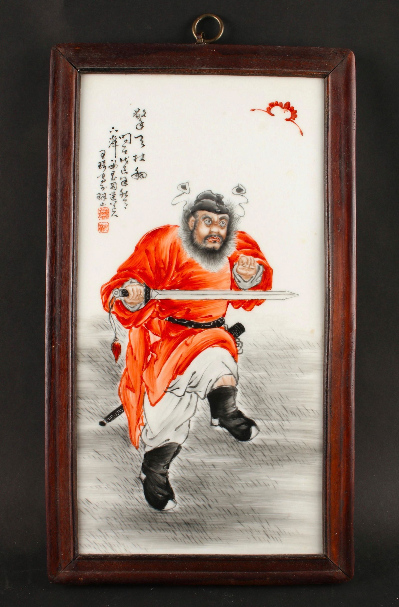 WANG QI STYLE PORCELAIN PLAQUE: A warrior in orange robes is holding a sword across his body. Calligraphy and artist mark on upper left. 9 1/2" X 16 1/2" $1000 - $1500 Please contact us for high resolution images of