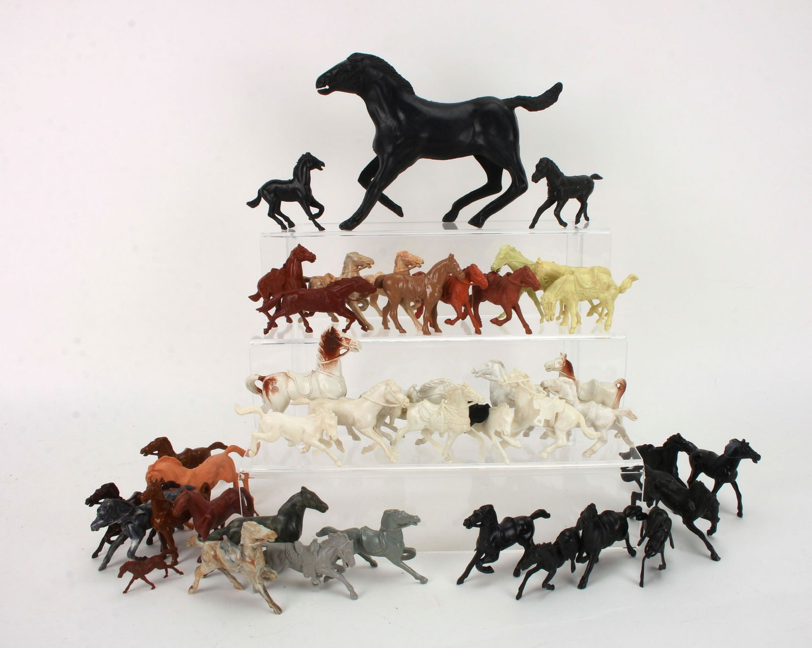 LOT OF 41 BERGEN PLUS PLASTIC TOY HORSES: A collection of plastic horses, some made by Bergen. $40 - $80 Please contact us for high resolution images of this lot. Shipping: We are able to pack and ship this item to an address in th