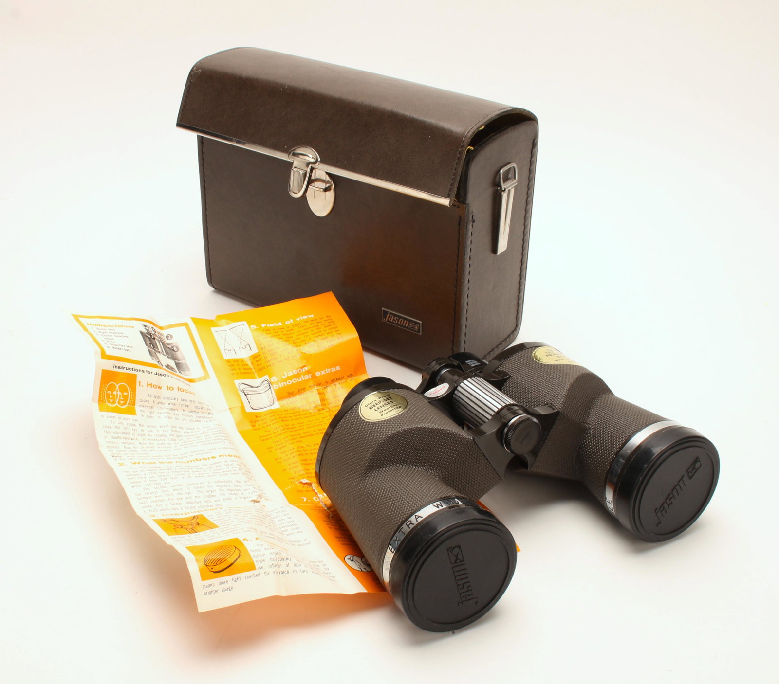 JASON STATESMAN BINOCULARS IN CASE: Model 151 with magnesium frame, 7 x 50 extra wide angle 11 degree. Field 578 ft at 1000 yds. UVC optics. With case and instruction sheet. 8 1/2 x 6 x 3 1/2" $100 - $200 Please contact us fo