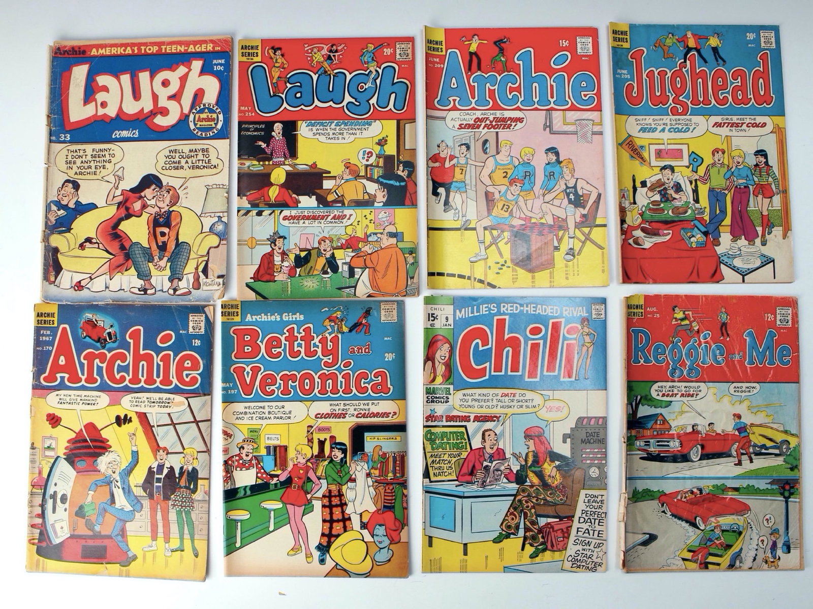 VINTAGE ARCHIE COMIC BOOK LOT: Eight comics in total. $100 - $200 Please contact us for high resolution images of this lot. Shipping: Shipping this lot to an address in the United States will cost $15.00 for the first lo