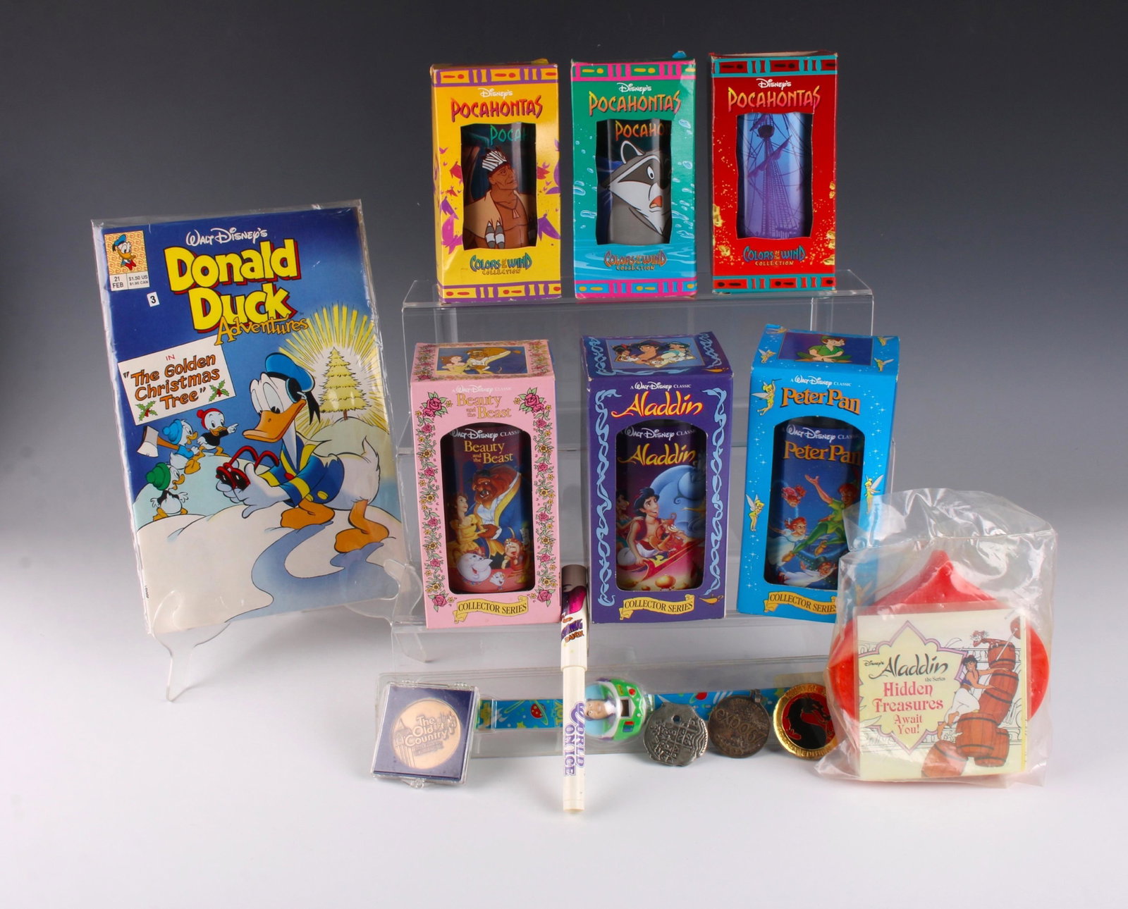 6 DISNEY COLLECTORS SERIES GLASSES: Three Pocahontas, Beauty and the Beast, and Peter Pan collector's series drinking glasses. Toy Story watch, new in case. Alladin hidden treasure case. Monteal Expo 67 coin. 1992 Mortal Kombat coin. Pi