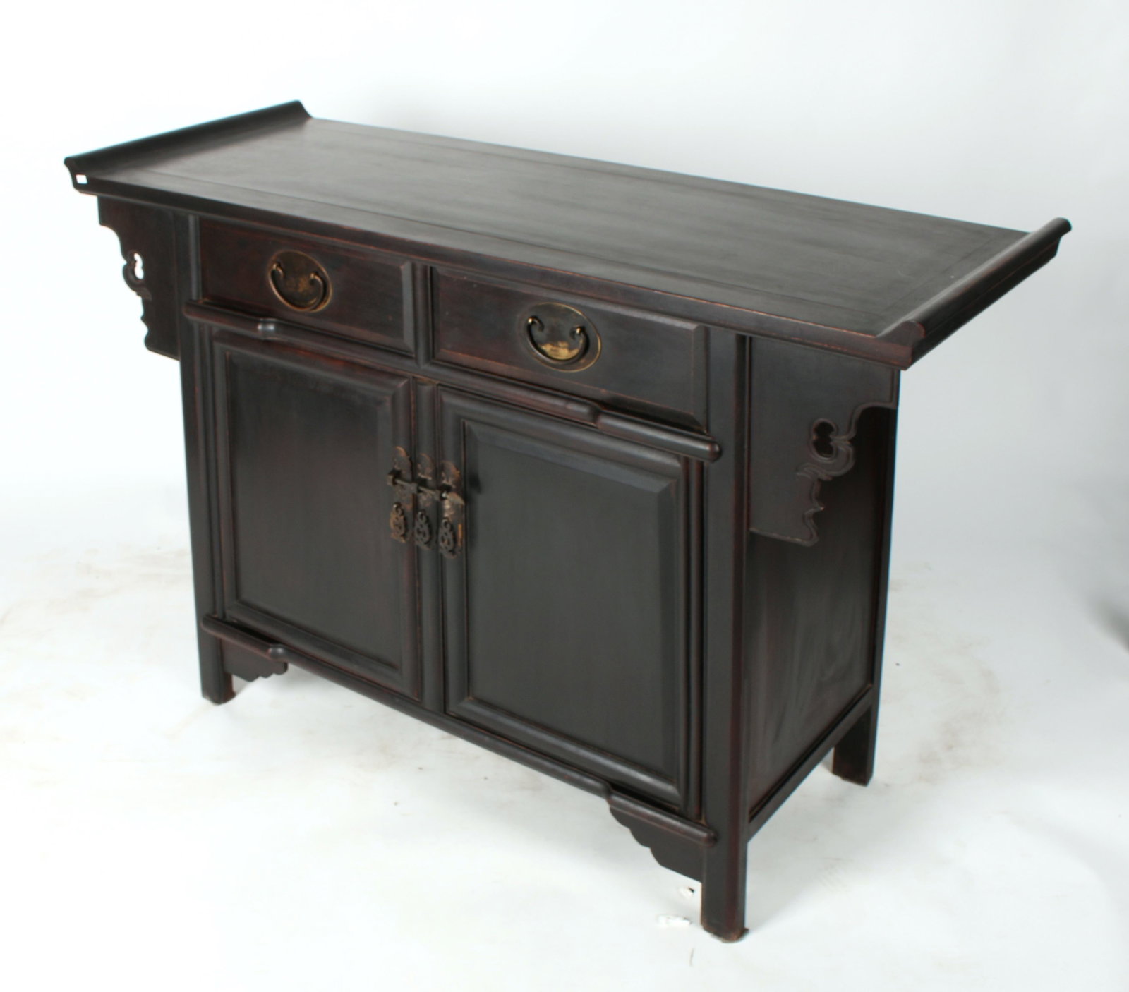 ZITAN ALTAR CABINET: Two drawers over two cabinet doors. Decorative flanges. Provenance: private collection. 41" X 18" X 31&