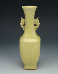 SMALL YELLOW CRACKLE VASE: Glazed in yellow with a large all over craquelure finish. Small pierced handles flank the neck. Marked on the bottom. 2 1/2" X 8" $100 - $200 Please contact us for high resolution imag