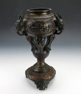 TALL TRIPOD BRONZE CENSER: Elaborate censer in several levels. The top has three beasts with tongued handles standing on tripod legs formed of beasts with feet coming out of their mouths. Those stands on an orb which stands on