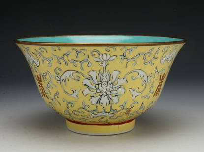 FAMILLE JUANE FLORAL BOWL: White flowers on a yellow ground with orange characters in between. Glazed turquoise on the inside. Marked on the bottom. 6" X 3" $300 - $500 Please contact us for high resolution images