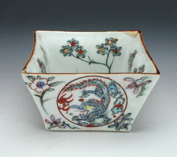 SMALL SQUARE PORCELAIN DRAGON BOWL: The central motif is of a dragon with flaming pearl, the inner sides of the bowl are flowers. The outer sides of the bowl repeat the circular dragon motif. 4" X 2 1/2" $100 - $200 Ple