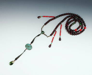 CHAO ZHU COURT NECKLACE: Maroon and green beads, Peking glass pendants, and fabric tassels with a meander border. $200 - $400 Please contact us for high resolution images of this lot. Shipping: We are able to pack and