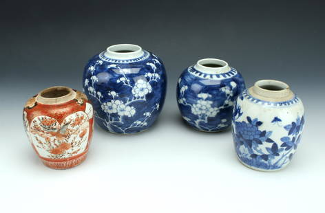 4 PIECE ASSORTED GINGER JARS: Three blue and white ginger jars with floral motifs, one Japanese red and white ginger jar with gold accents. This is the only one marked on the bottom. 5 1/2" X 5 1/2" $100 - $200 Please