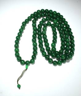 LONG JADE MALA NECKLACE: Comprised of green jade beads. 26" $100 - $200 Please contact us for high resolution images of this lot. Shipping: We are able to pack and ship this item to an