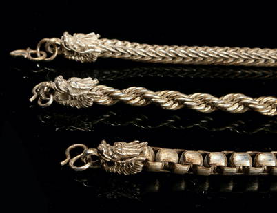 3 DRAGON CLASP BRACELETS: Three different link chain bracelets each with dragon head closures.  $40 - $80 Please contact us for high resolution images of this lot. Shipping: We are able to pack and ship this item to