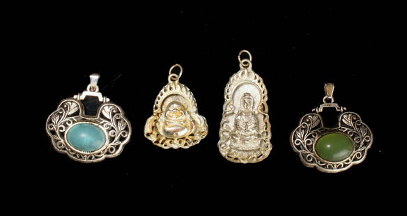 4 CHINESE PENDANTS: Two are shrine forms containing Buddhas with calligraphy on the back, two are pierced and have bezel set cabochon stones on one side. $40 - $80 Please contact us for high resolution images of this