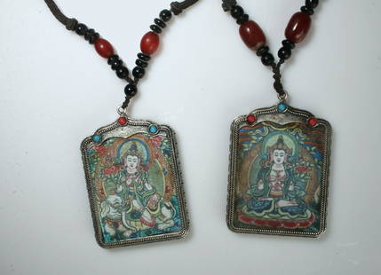 2 BUDDHA PENDANT NECKLACES: They each have an image under glass on one side. They are strung on cord with beads. 2 1/2" $40 - $80 Please contact us for high resolution images of this lot. Shipping: We are able to pack