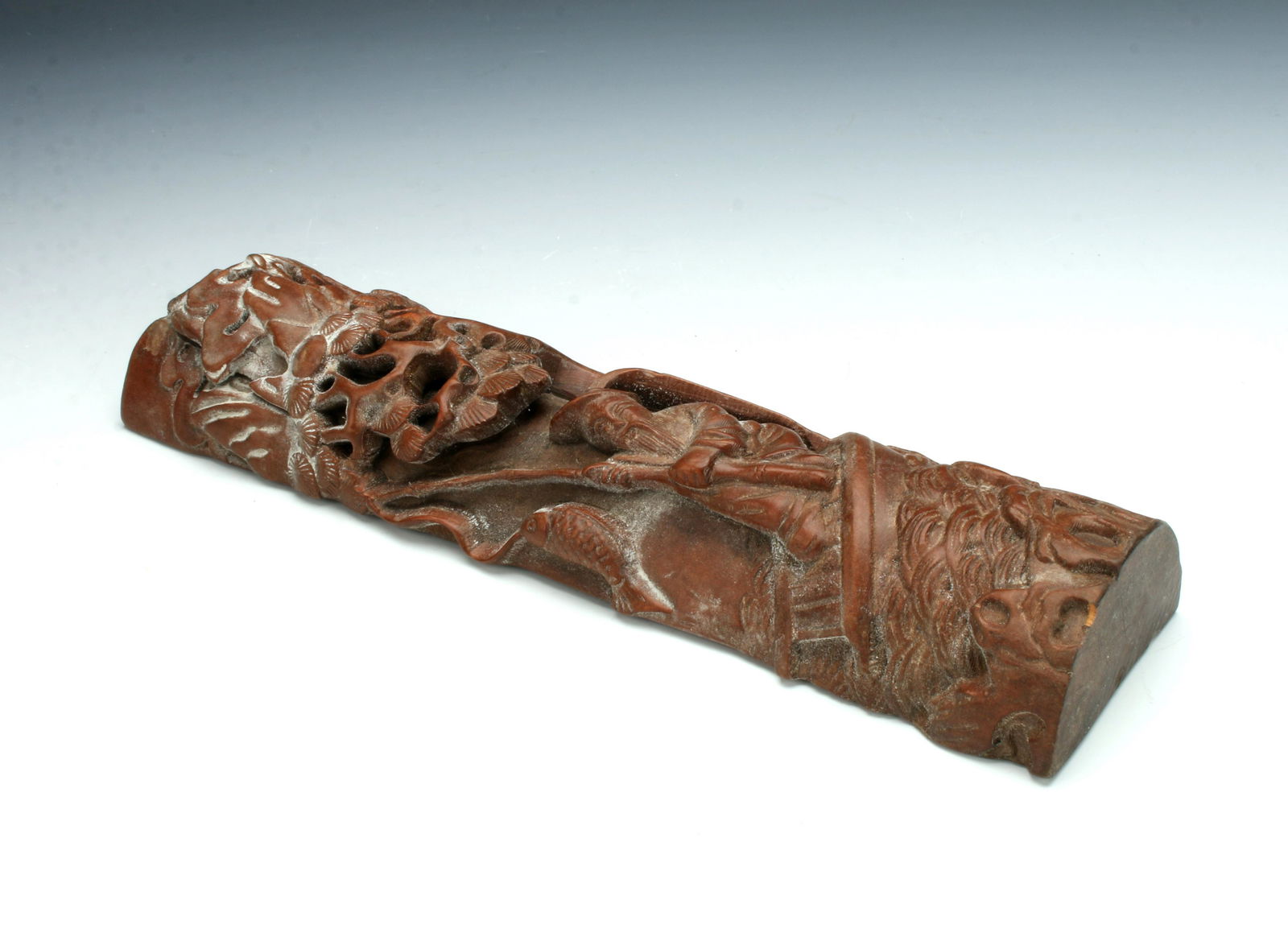 CARVING OF FISHERMAN IN A RAFT (1 of 7)